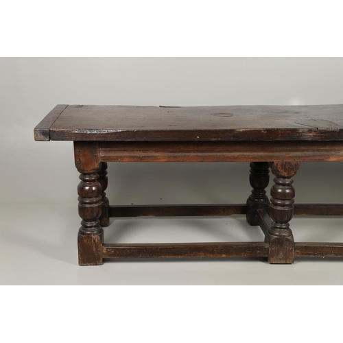 1299 - A 17TH CENTURY OAK REFECTORY TABLE. the single plank top with three unusual cut out hearts above a c... 