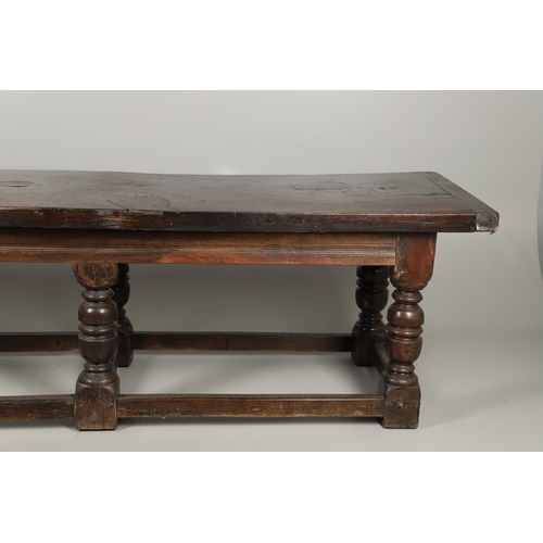 1299 - A 17TH CENTURY OAK REFECTORY TABLE. the single plank top with three unusual cut out hearts above a c... 