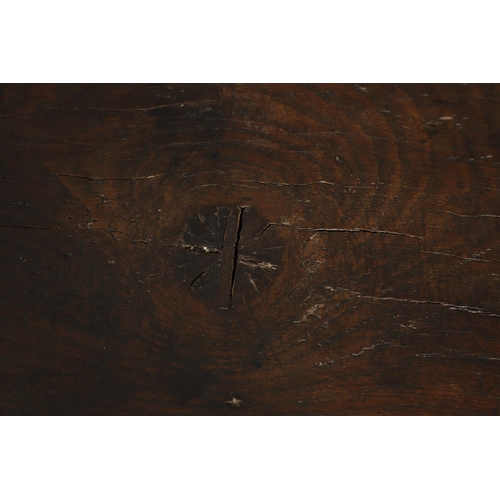 1299 - A 17TH CENTURY OAK REFECTORY TABLE. the single plank top with three unusual cut out hearts above a c... 