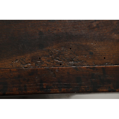 1299 - A 17TH CENTURY OAK REFECTORY TABLE. the single plank top with three unusual cut out hearts above a c... 