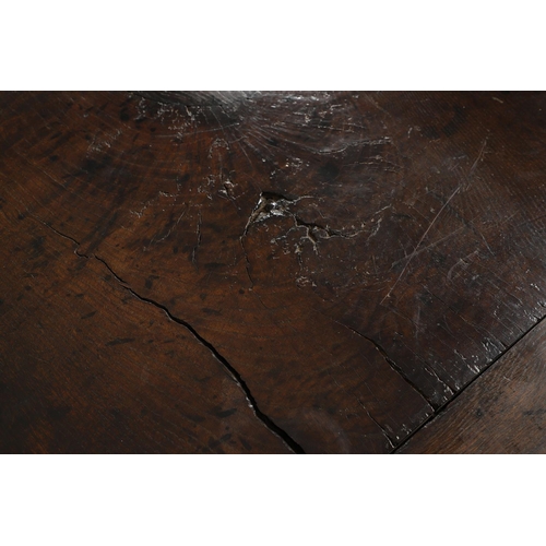 1299 - A 17TH CENTURY OAK REFECTORY TABLE. the single plank top with three unusual cut out hearts above a c... 