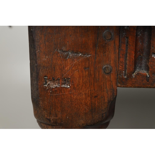 1299 - A 17TH CENTURY OAK REFECTORY TABLE. the single plank top with three unusual cut out hearts above a c... 