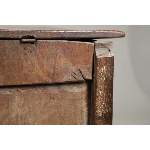 1301 - A LATE 17TH CENTURY OAK COFFER. the triple plank top enclosing an interior with candle box, over a t... 