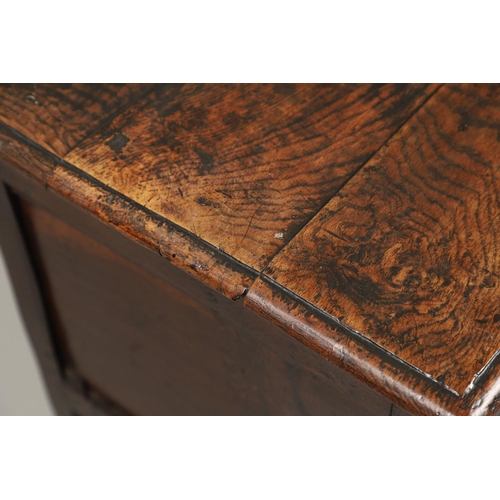 1301 - A LATE 17TH CENTURY OAK COFFER. the triple plank top enclosing an interior with candle box, over a t... 