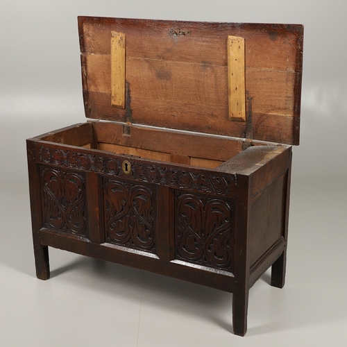 1301 - A LATE 17TH CENTURY OAK COFFER. the triple plank top enclosing an interior with candle box, over a t... 