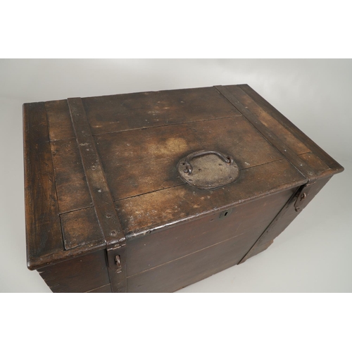 1303 - AN 18TH CENTURY OAK AND IRON BOUND SILVER CHEST. the hinged plank lid and sides with forged iron han... 