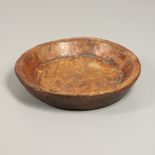 1304 - A LARGE RUSTIC CARVED HARDWOOD BOWL. possibly African, height 10cm, diameter 51cm.