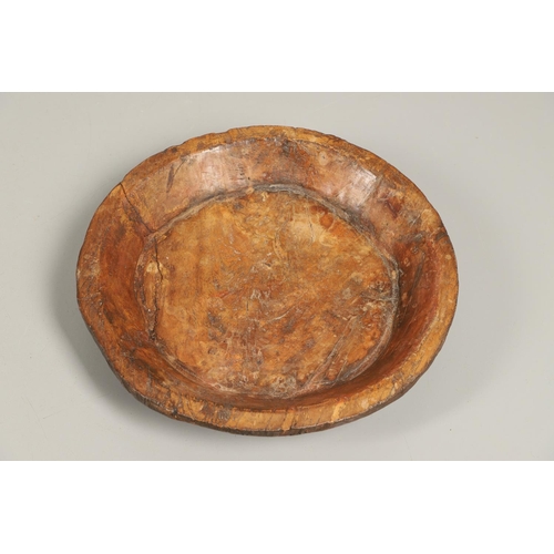 1304 - A LARGE RUSTIC CARVED HARDWOOD BOWL. possibly African, height 10cm, diameter 51cm.