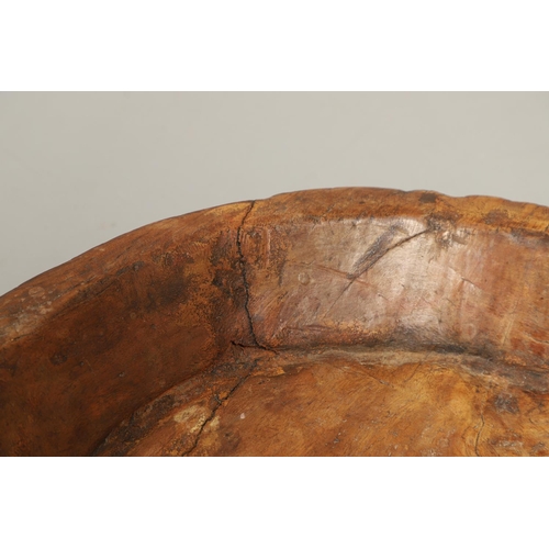 1304 - A LARGE RUSTIC CARVED HARDWOOD BOWL. possibly African, height 10cm, diameter 51cm.