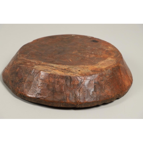 1304 - A LARGE RUSTIC CARVED HARDWOOD BOWL. possibly African, height 10cm, diameter 51cm.