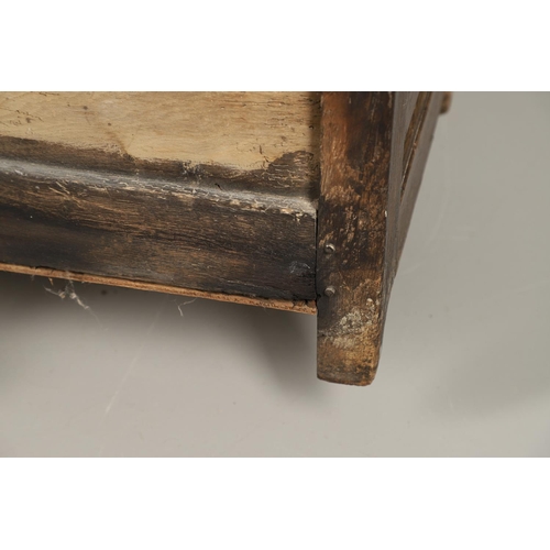 1307 - AN 18TH CENTURY OAK BOX SETTLE. the quadruple panelled back with carved arch ogee detail over a hing... 