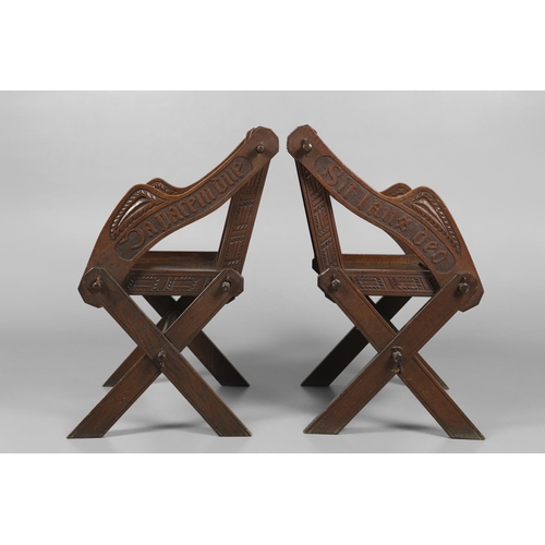 1309 - A PAIR OF VICTORIAN OAK GLASTONBURY CHAIRS. of typical pegged construction, the carved panel back ce... 