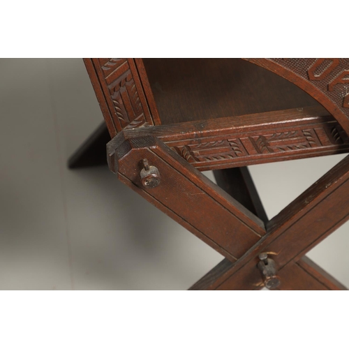 1309 - A PAIR OF VICTORIAN OAK GLASTONBURY CHAIRS. of typical pegged construction, the carved panel back ce... 