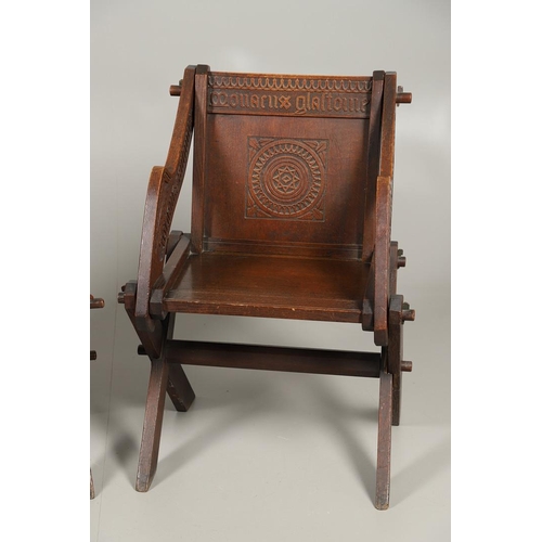 1309 - A PAIR OF VICTORIAN OAK GLASTONBURY CHAIRS. of typical pegged construction, the carved panel back ce... 