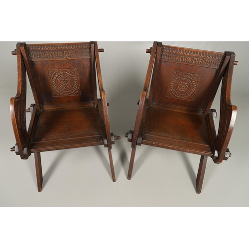 1309 - A PAIR OF VICTORIAN OAK GLASTONBURY CHAIRS. of typical pegged construction, the carved panel back ce... 