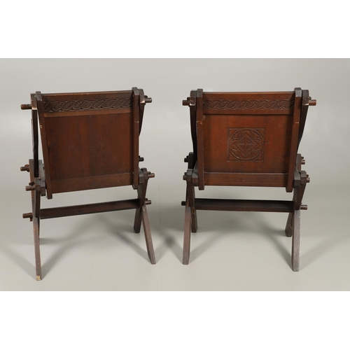 1309 - A PAIR OF VICTORIAN OAK GLASTONBURY CHAIRS. of typical pegged construction, the carved panel back ce... 