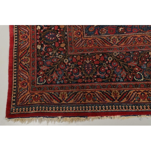 1310 - A MASHAD CARPET, NORTH EAST PERSIA, CIRCA 1920. the raspberry field richly decorated with vines cent... 