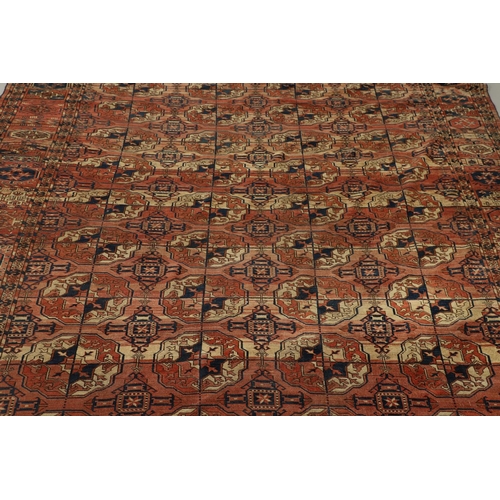 1312 - A TEKKE TURKMAN RUG, EMIRATE OF BUKHARA, CIRCA 1890. the madder field with four columns of guls encl... 