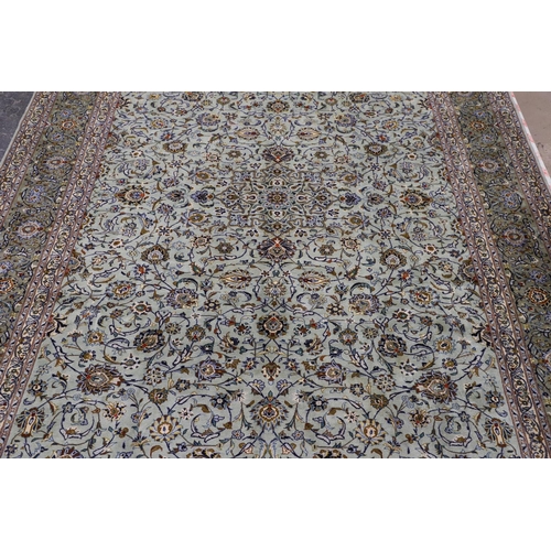 1313 - A KASHAN CARPET, CENTRAL PERSIA, CIRCA 1970. the ice blue field of palmettes and vines around a meda... 