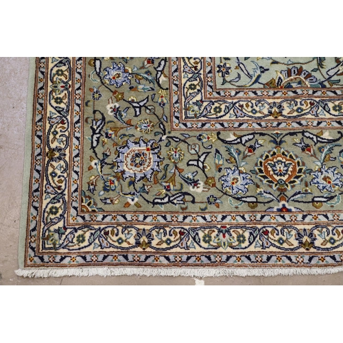 1313 - A KASHAN CARPET, CENTRAL PERSIA, CIRCA 1970. the ice blue field of palmettes and vines around a meda... 