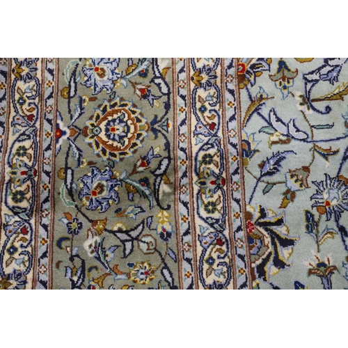 1313 - A KASHAN CARPET, CENTRAL PERSIA, CIRCA 1970. the ice blue field of palmettes and vines around a meda... 