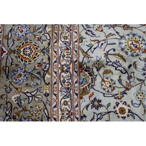 1313 - A KASHAN CARPET, CENTRAL PERSIA, CIRCA 1970. the ice blue field of palmettes and vines around a meda... 