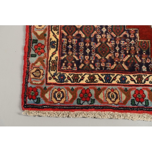 1318 - A SENNEH RUNNER, PERSIAN KURDISTAN, CIRCA 1980. the field with a column of winged diamond medallions... 