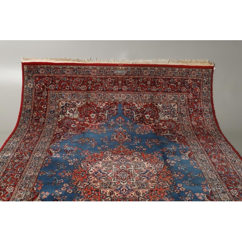 1319 - AN ORIENTAL CARPET, THIRD QUARTER 20TH CENTURY. the sky blue field with flower head medallion framed... 