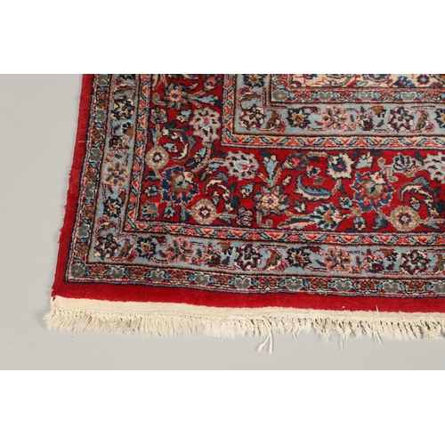 1319 - AN ORIENTAL CARPET, THIRD QUARTER 20TH CENTURY. the sky blue field with flower head medallion framed... 