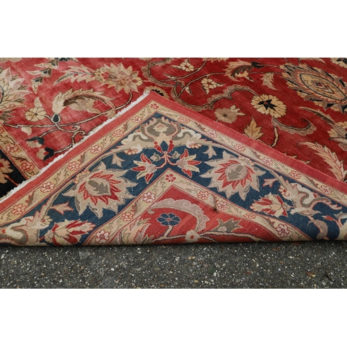 1320 - A MODERN AFGHAN 'ZIEGLER' CARPET. the salmon pink field of serrated leaves and flower heads enclosed... 