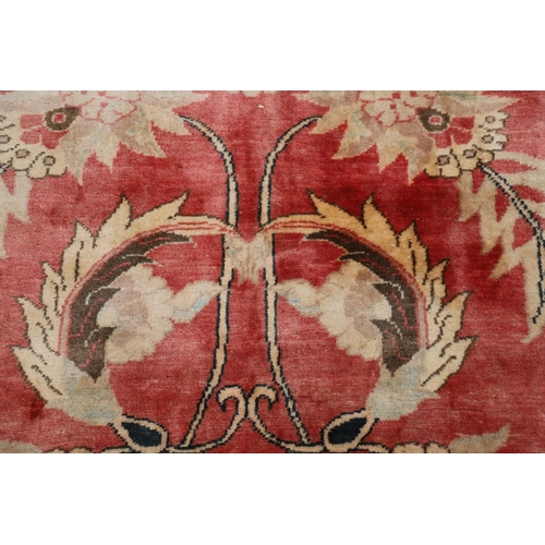 1320 - A MODERN AFGHAN 'ZIEGLER' CARPET. the salmon pink field of serrated leaves and flower heads enclosed... 