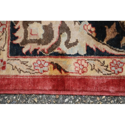 1320 - A MODERN AFGHAN 'ZIEGLER' CARPET. the salmon pink field of serrated leaves and flower heads enclosed... 