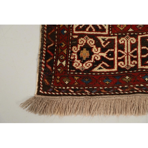 1321 - A KONAKEND RUG, NORTH EAST CAUCASUS, CIRCA 1900. the charcoal field of angular vines enclosed by Kuf... 