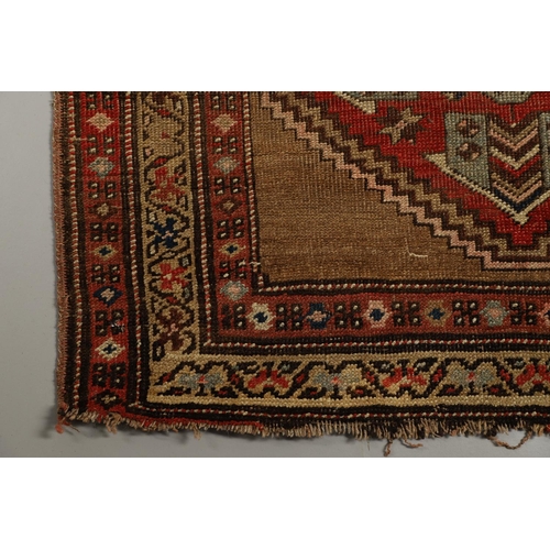 1324 - A NORTH WEST PERSIAN RUNNER, CIRCA 1900. the camel ground with a column of stepped diamond medallion... 