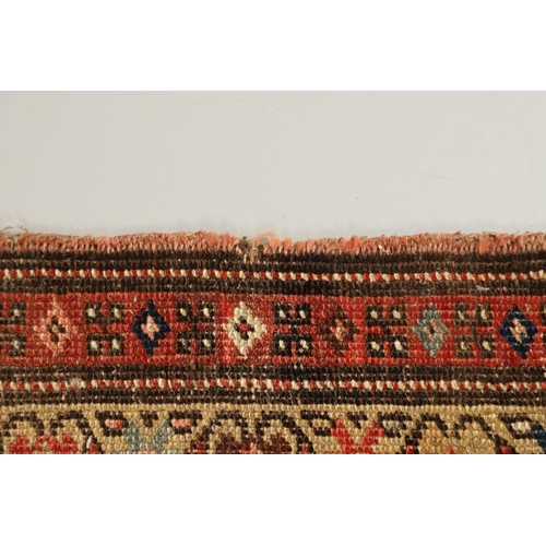 1324 - A NORTH WEST PERSIAN RUNNER, CIRCA 1900. the camel ground with a column of stepped diamond medallion... 