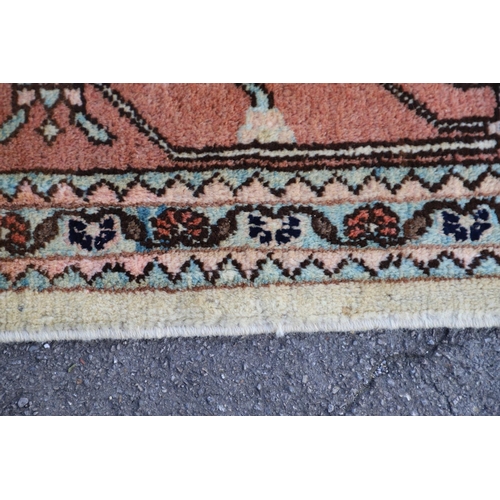 1332 - A WEST ANATOLIAN CARPET OF UNUSUAL SIZE, CIRCA 1980. the cream field with columns of heraldic motifs... 