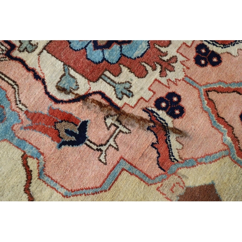 1332 - A WEST ANATOLIAN CARPET OF UNUSUAL SIZE, CIRCA 1980. the cream field with columns of heraldic motifs... 