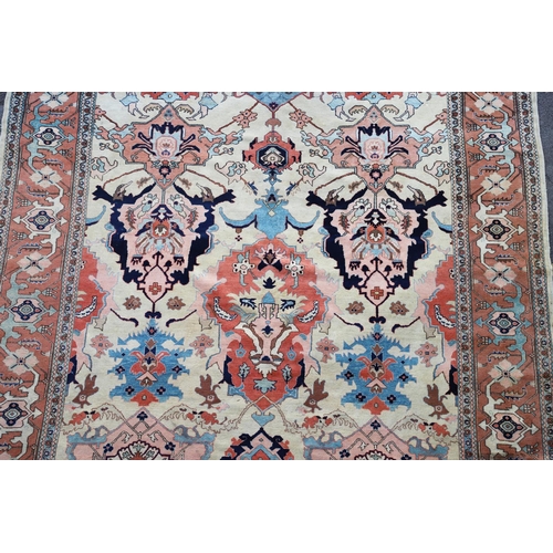 1332 - A WEST ANATOLIAN CARPET OF UNUSUAL SIZE, CIRCA 1980. the cream field with columns of heraldic motifs... 