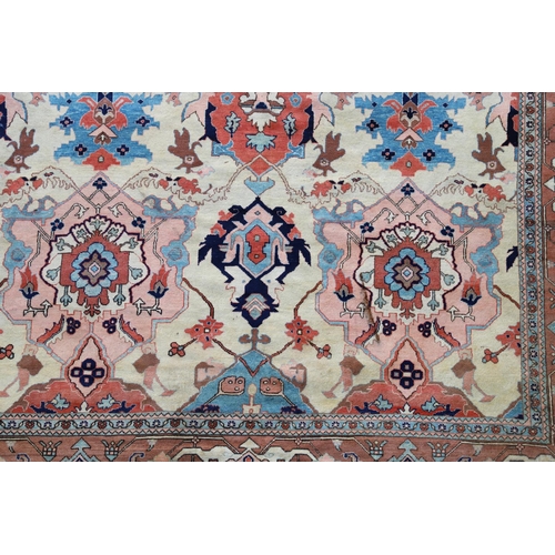 1332 - A WEST ANATOLIAN CARPET OF UNUSUAL SIZE, CIRCA 1980. the cream field with columns of heraldic motifs... 