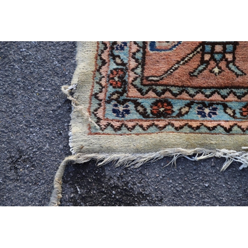 1332 - A WEST ANATOLIAN CARPET OF UNUSUAL SIZE, CIRCA 1980. the cream field with columns of heraldic motifs... 