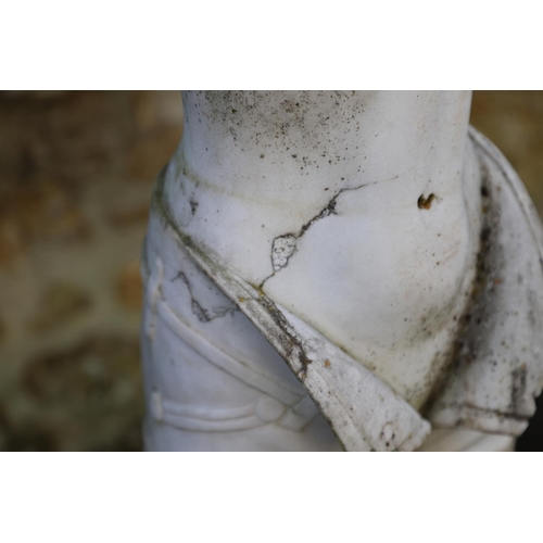 1338 - A CARVED MARBLE FIGURE. depicting a nude female removing her clothes, on a rectangular plinth, heigh... 