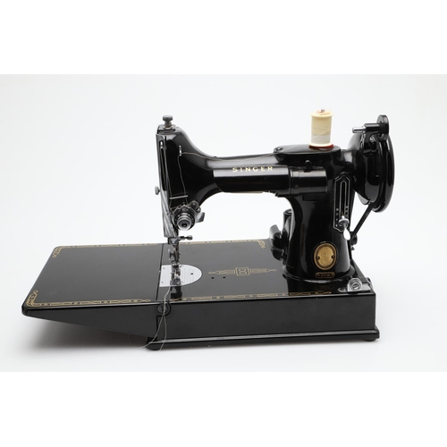 515 - CASED PORTABLE SINGER SEWING MACHINE - 221K. A cased Singer 221K portable sewing machine, with it's ... 