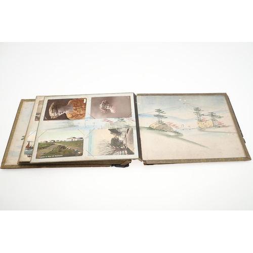 518 - A LATE 19TH/EARLY 20TH CENTURY JAPANESE/CHINESE POSTCARD ALBUM. A large Japanese lacquered album con... 