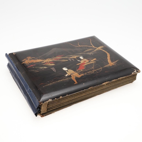 518 - A LATE 19TH/EARLY 20TH CENTURY JAPANESE/CHINESE POSTCARD ALBUM. A large Japanese lacquered album con... 