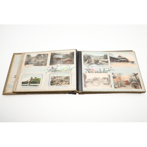 518 - A LATE 19TH/EARLY 20TH CENTURY JAPANESE/CHINESE POSTCARD ALBUM. A large Japanese lacquered album con... 