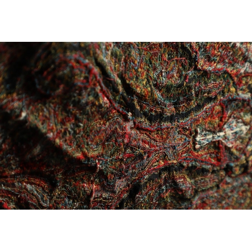 523 - ANTIQUE PAISLEY SHAWL. Probably late 19thc, a square shaped woollen shawl, in typical colours with b... 