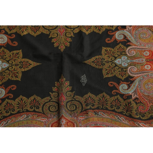 524 - VICTORIAN PAISLEY SHAWL - SIGNED. A large Paisley woollen shawl, with a coloured fringe and signed w... 