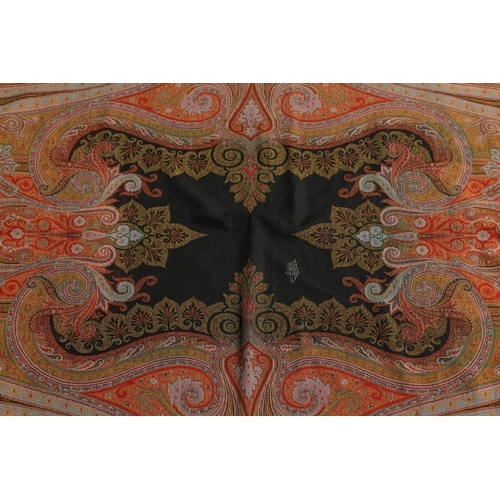 524 - VICTORIAN PAISLEY SHAWL - SIGNED. A large Paisley woollen shawl, with a coloured fringe and signed w... 