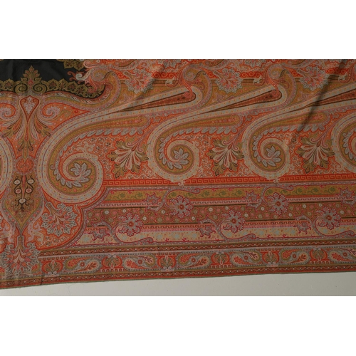 524 - VICTORIAN PAISLEY SHAWL - SIGNED. A large Paisley woollen shawl, with a coloured fringe and signed w... 