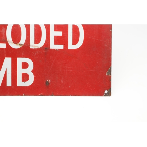 529 - VINTAGE ENAMEL SIGN - 'KEEP CLEAR UNEXPLODED BOMB'. A vintage red enamel sign with white lettering, ... 